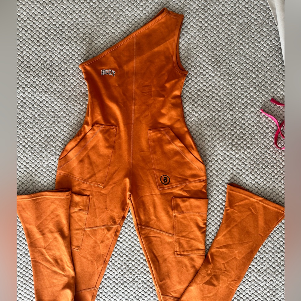 Body by Raven Tracy CAMP 1 PIECE CARGO
JUMPSUIT (BURNT ORANGE) size M